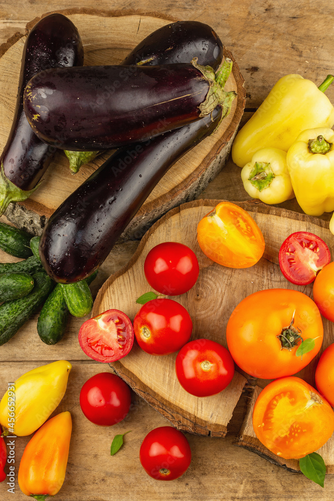 Assortment of fresh vegetables on a wooden background