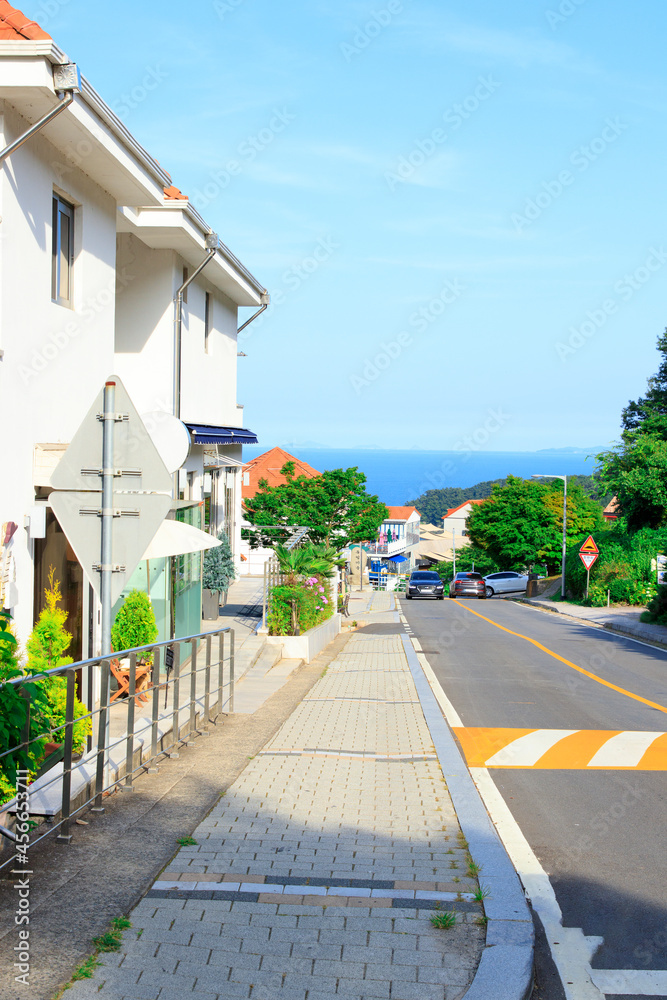 Empty road with red roof and ocean view at Namhae German Village, South Korea