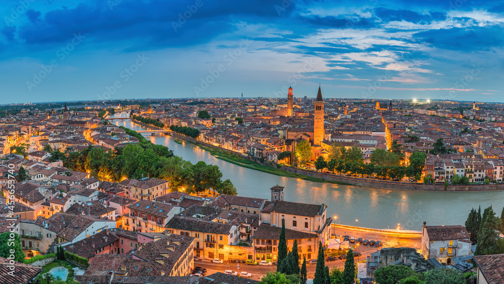 Verona Italy, high angle view panorama night city skyline at Adige river