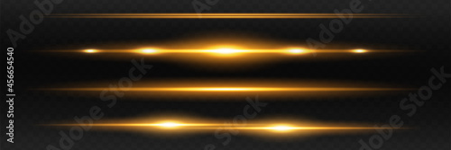 yellow horizontal lens flares pack. Laser beams, horizontal light rays. Beautiful light flares. Glowing streaks on dark background.
