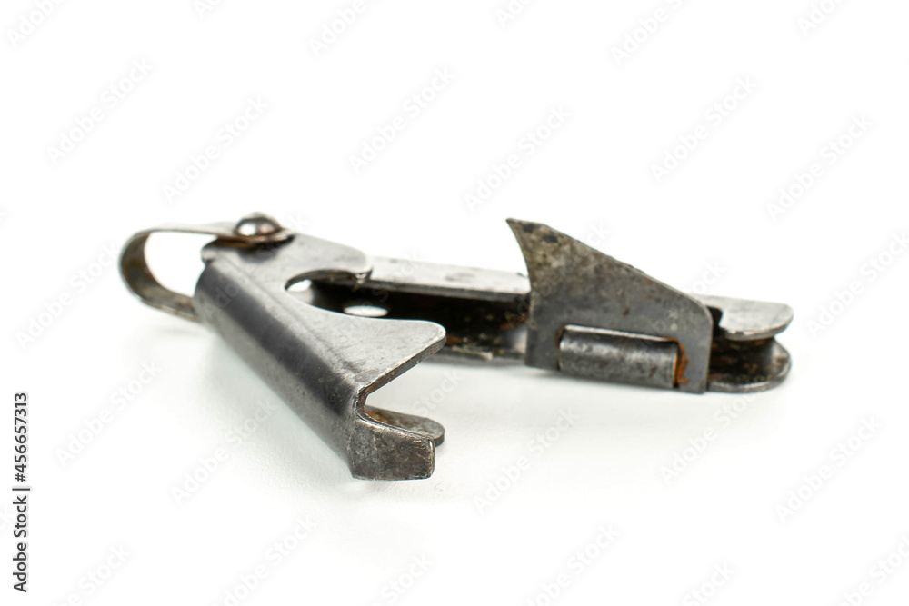 One old army can opener isolated on white background One old army can opener isolated on white background