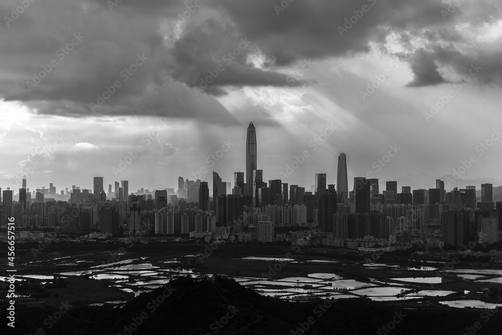 Silhouette of skyline of Shenzhen city, China under sunset. Viewed from Hong Kong border