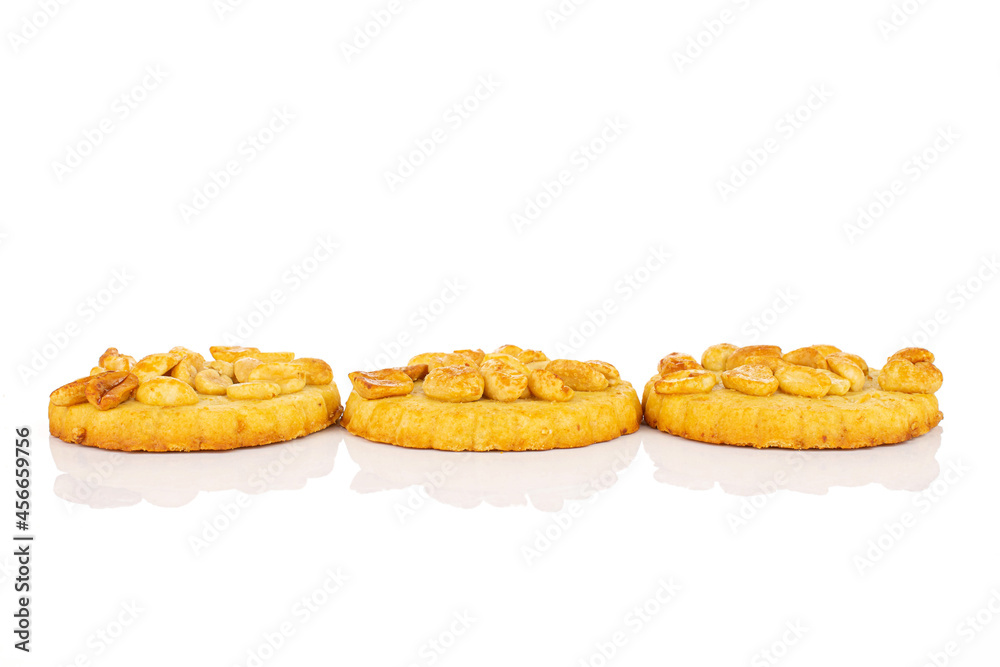 Group of three whole delicious cookie with peanuts in row on white background Group of three whole delicious cookie with peanuts in row on white background