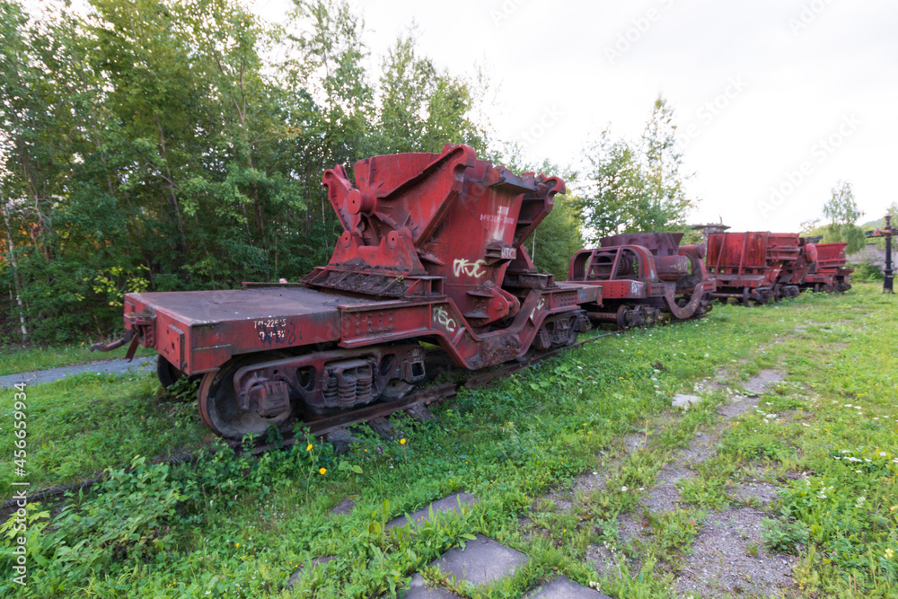 Fototapeta premium red trolley with a container on rails