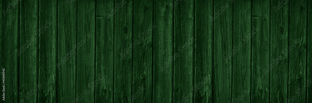 Dark green wooden background with copy space for design. Wide banner. Painted wood planks. Dark green wooden background with copy space for design. Wide banner. Painted wood planks.