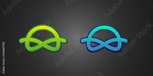 Green and blue Nautical rope knots icon isolated on black background. Rope tied in a knot. Vector