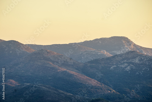 Mountain cliffs against sky sunset