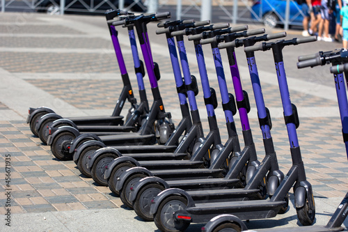 Electric scooters for rent standing in the city center