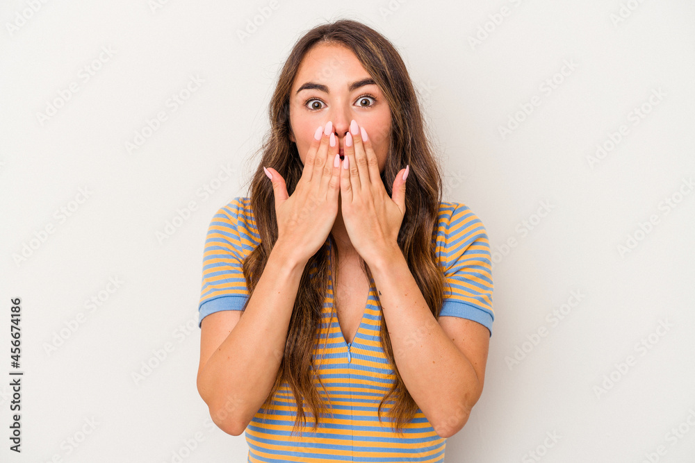 Young caucasian woman isolated on white background shocked covering mouth with hands. Young caucasian woman isolated on white background shocked covering mouth with hands.