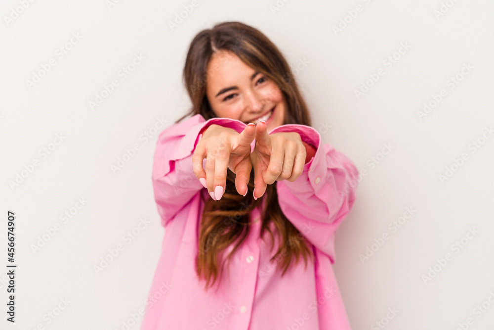 Young caucasian woman isolated on white background pointing to front with fingers. Young caucasian woman isolated on white background pointing to front with fingers.