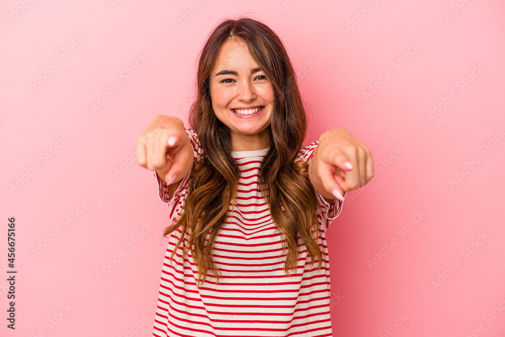Young caucasian woman isolated on pink background cheerful smiles pointing to front. Young caucasian woman isolated on pink background cheerful smiles pointing to front.
