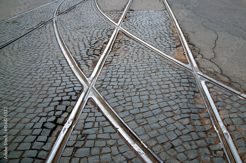 Slika na platnu abstract background with tram rails on paving stones and asphalt