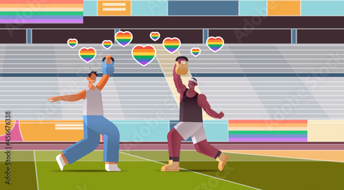 guys lovers doing physical exercises with dumbbells on stadium gays love parade transgender LGBT concept