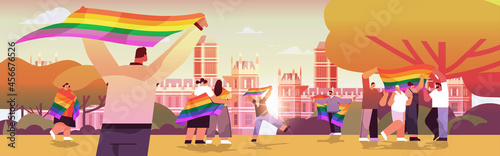 mix race people holding lgbt rainbow flags gay lesbian love parade pride festival transgender love concept