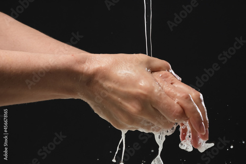 Washing your hand by alcohol sanitizer gel for protecting infection from a Covid-19 virus and other viruses.