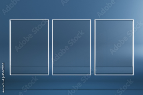 Empty three rectangular glass frame posters on blue background. Mock up, 3D Rendering.