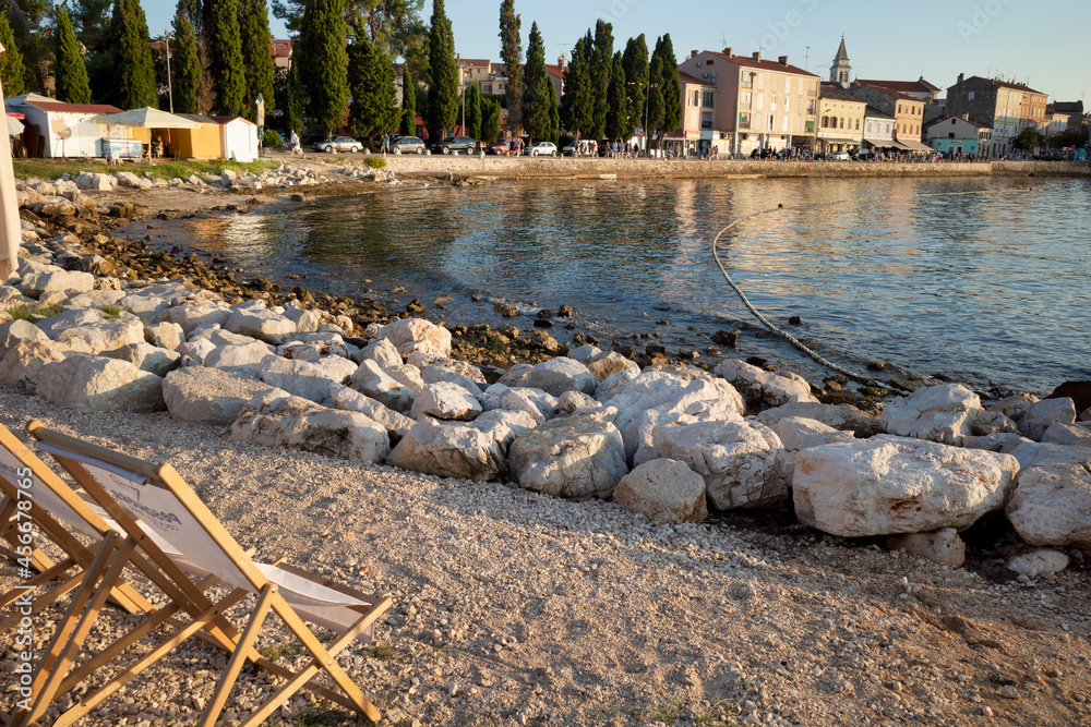 Rijeka, Croatia - August 11, 2021: Resort on the Adriatic Sea. City beaches, vegetation and buildings in Croatia. Seascape with a stone shore.