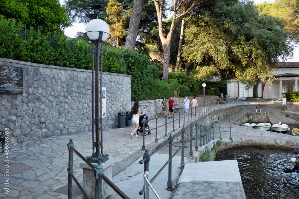 Rijeka, Croatia - August 11, 2021: Resort on the Adriatic Sea. City beaches, vegetation and buildings in Croatia. Seascape with a stone shore.