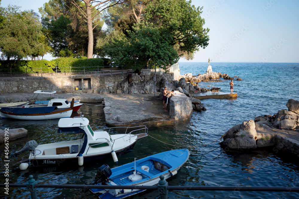 Rijeka, Croatia - August 11, 2021: Resort on the Adriatic Sea. City beaches, vegetation and buildings in Croatia. Seascape with a stone shore.
