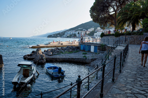 Obraz na płótnie Rijeka, Croatia - August 11, 2021: Resort on the Adriatic Sea. City beaches, vegetation and buildings in Croatia. Seascape with a stone shore. w salonie
