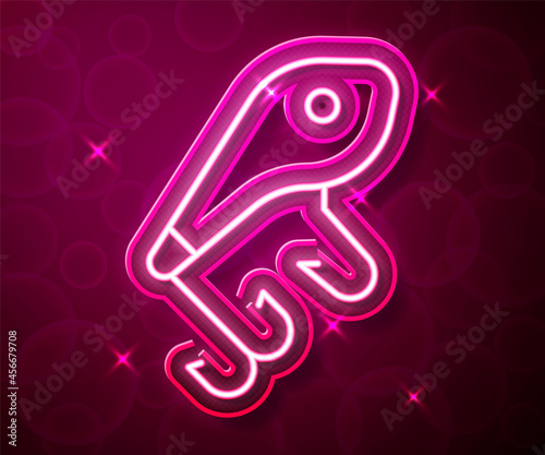 Glowing neon line Fishing lure icon isolated on red background. Fishing tackle. Vector