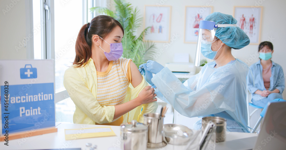 woman has vaccine injection woman has vaccine injection