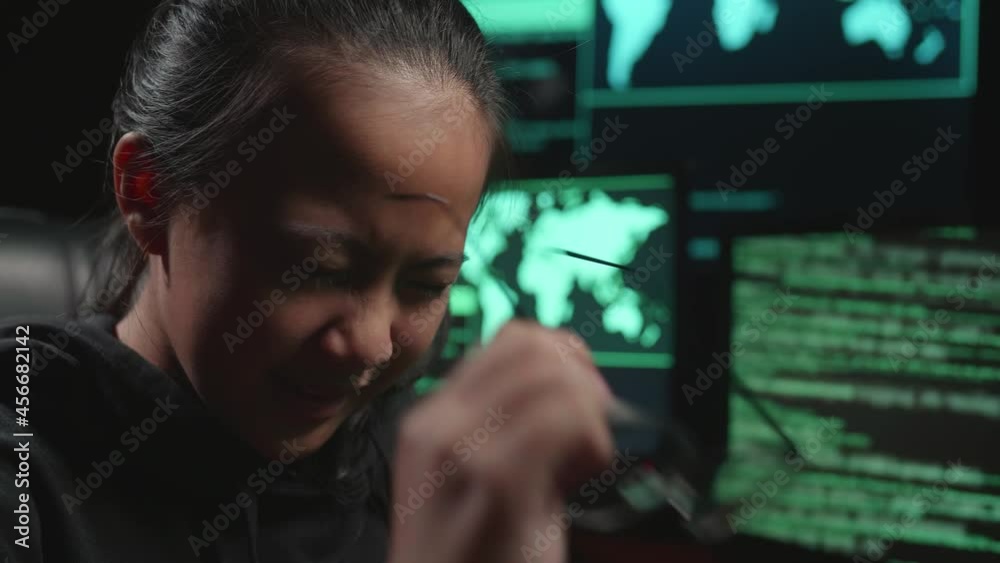 Asian Young Girl Hacker Upset With Lock Key On Computer Screen
