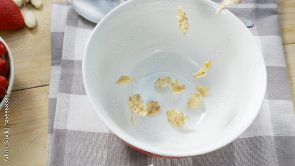 Beautiful topshot of muesli falling in bow Beautiful topshot of muesli falling in bow