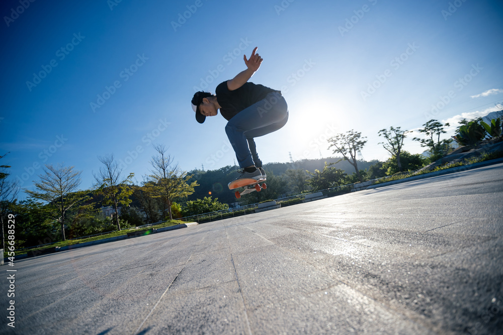 Skateboarder skateboarding outdoors in city Skateboarder skateboarding outdoors in city