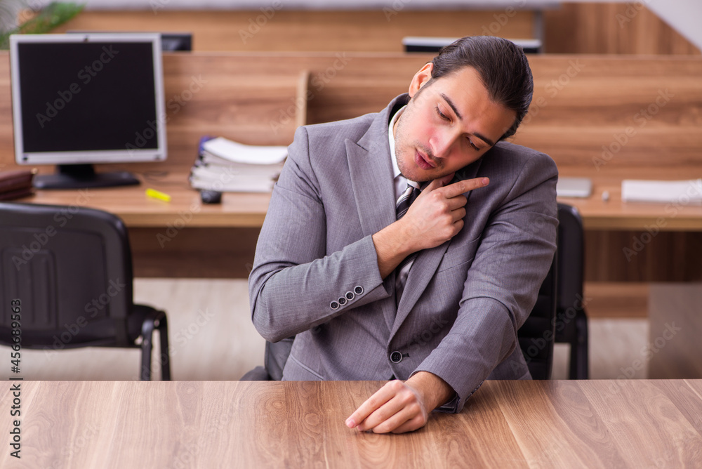 Young businessman employee sitting in the office Young businessman employee sitting in the office