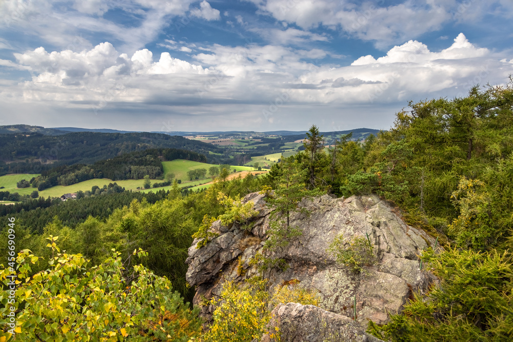 Fototapeta premium Rocky view point over beautiful summer landscape under blue sky with white clouds. Czech Republic, Europe.
