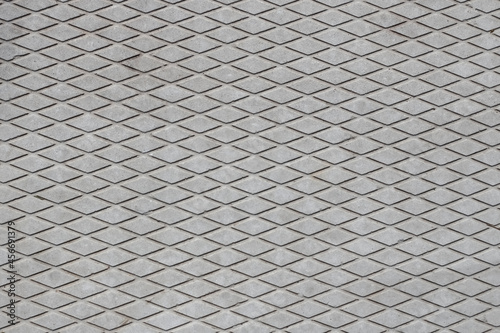 texture of a concrete slab with a pattern in the form of rhombuses for the background. abstract background.