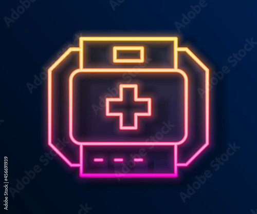 Glowing neon line First aid kit icon isolated on black background. Medical box with cross. Medical equipment for emergency. Healthcare concept. Vector