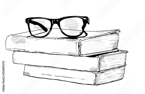 Hand drawn vector illustration of Books with reading glasses. Vintage sketch of law or University Studying books.
