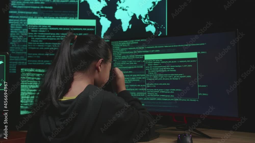 Asian Young Girl Hacker Upset With Multiple Computer Screens In Dark Room
Asian Young Girl Hacker Upset With Multiple Computer Screens In Dark Room