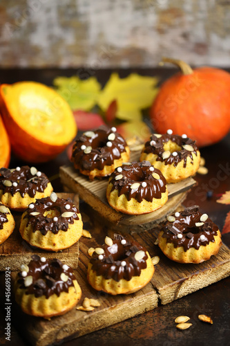 Pumpkin muffins with chocolate. Autumn dessert composition.