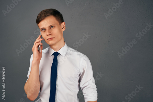 business man in shirt with tie talking on the phone professional office work