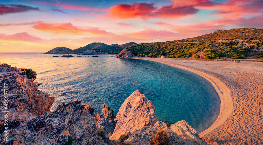 Calm summer view of Cheromylos beach. Wonderful summer sunrise on Euboea island, Greece. Majestic Aegean seascape. Beauty of nature concept background.