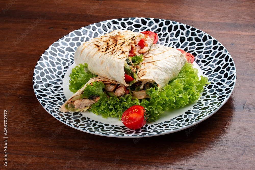 Fresh chicken roll with fresh tomatos, salad, cheese and onions. Shaurma, shawerma, fajita