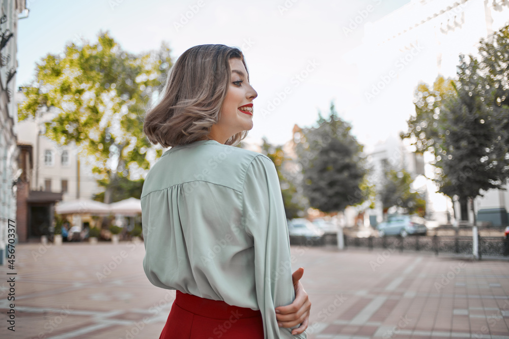 beautiful woman attractive look red lips walk in the park Fresh air