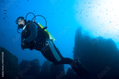 Diver over underwater mountains. Mediterranean sea. 