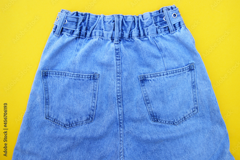 Flat lay, blue jeans detail, background texture. Flat lay, blue jeans detail, background texture.