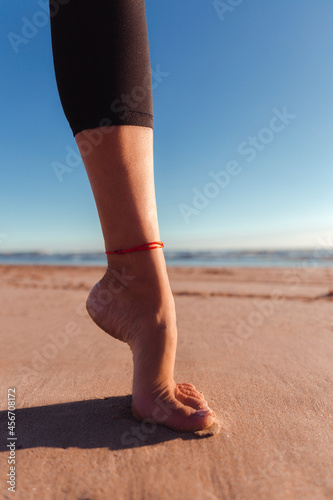 Balancing on foot on the beach
