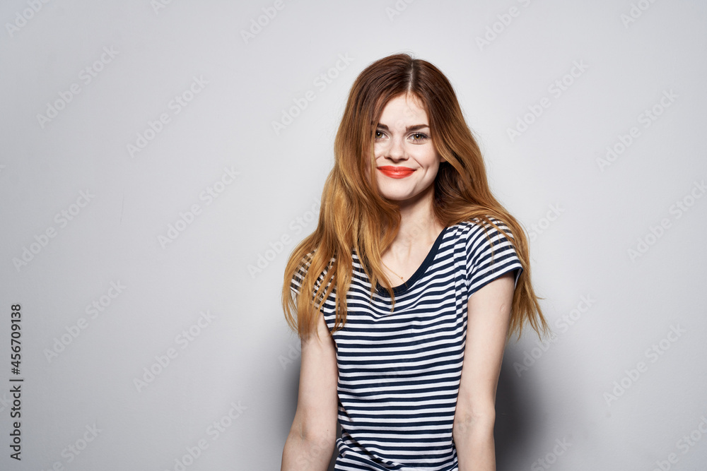 beautiful woman holding hair makeup posing fun fashion expression light background beautiful woman holding hair makeup posing fun fashion expression light background