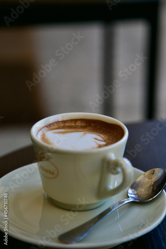 Hot coffe capuccino at a table on Italy