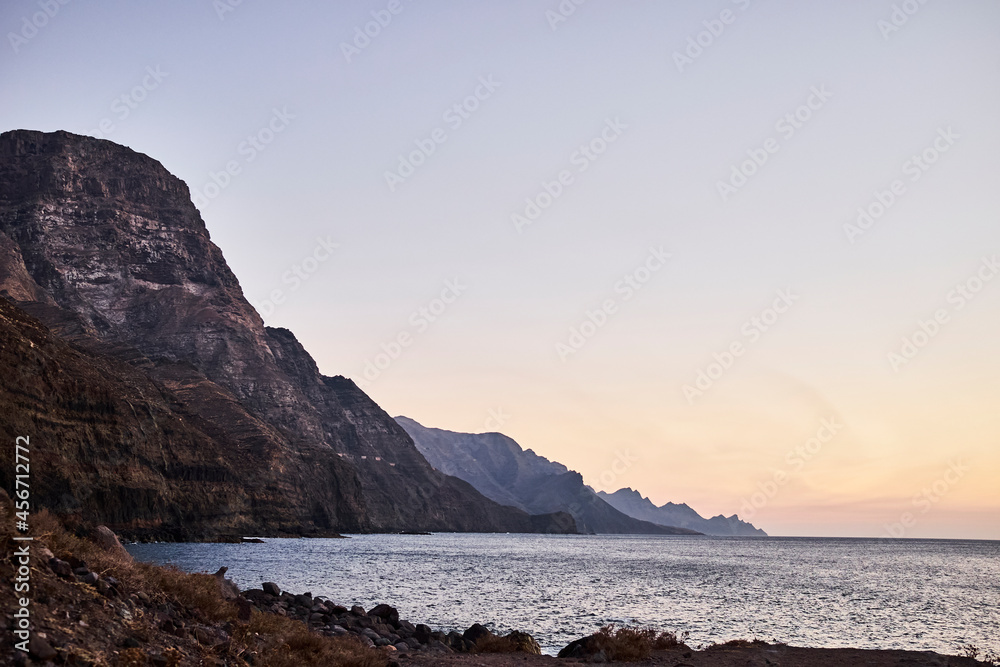 Sunset on a beach with cliffs Sunset on a beach with cliffs