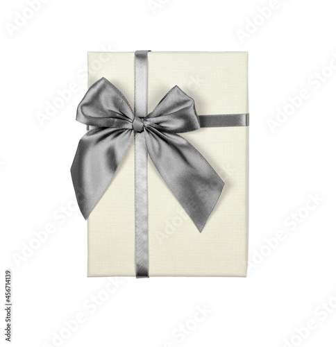 Beige gift box with silver bow on white background, isolate © Анастасія Шатирова