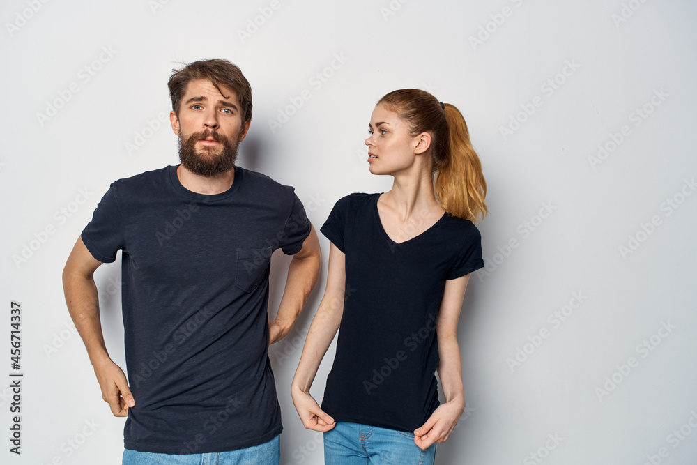 fashionable man and woman in black t-shirt sunglasses posing isolated background fashionable man and woman in black t-shirt sunglasses posing isolated background