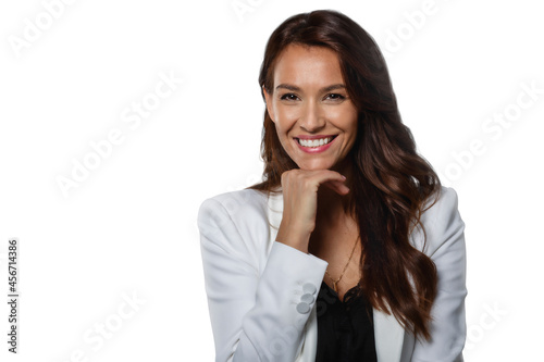 Studio shot of attractive woman with toothy smile standing at isolated white background © sepy
