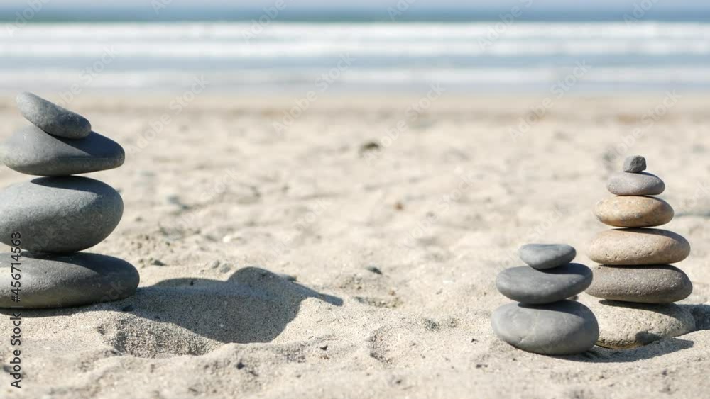 Balance Rocks Ocean Rock balancing on ocean beach, stones stacking by sea water waves ...